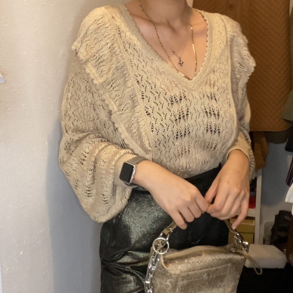 Woman’s frilled openwork sweater / blouse